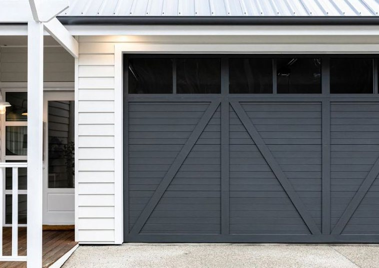 Tower X-Slat Barndoor Series — barn-style with X cross-bracing (page hero from Tower's brochure)